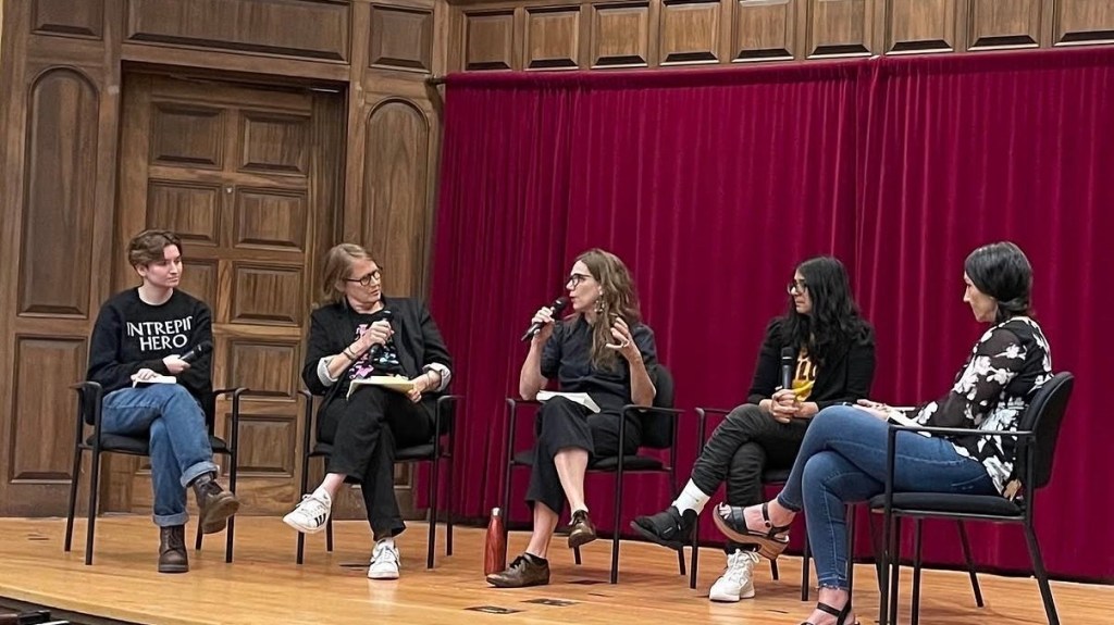 Jamir sits (far right) during a panel/roundtable discussion